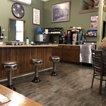 Flynnie's Diner - A view towards the back counter.  What I missed in this shot was their home made cinnamon rolls.  YUM! - American Near Me - Dixon, Illinois