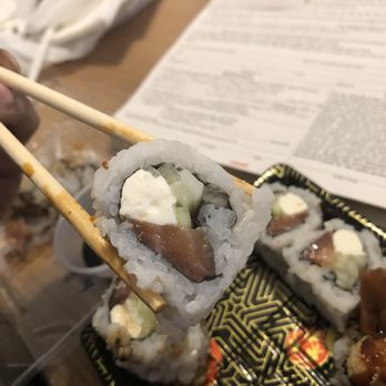 Little Teriyaki - a person holding chopsticks over a sushi - Bubble Tea Near Me - Newark, Delaware Little Teriyaki - a person holding chopsticks over a sushi - Bubble Tea Near Me - Newark, Delaware