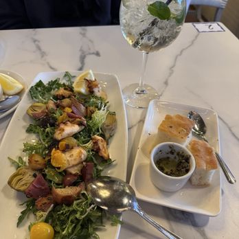 Oliver's Trattoria - Polipo, complimentary bread, and Aperol tini - Italian Near Me - Irvine, California Oliver's Trattoria - Polipo, complimentary bread, and Aperol tini - Italian Near Me - Irvine, California