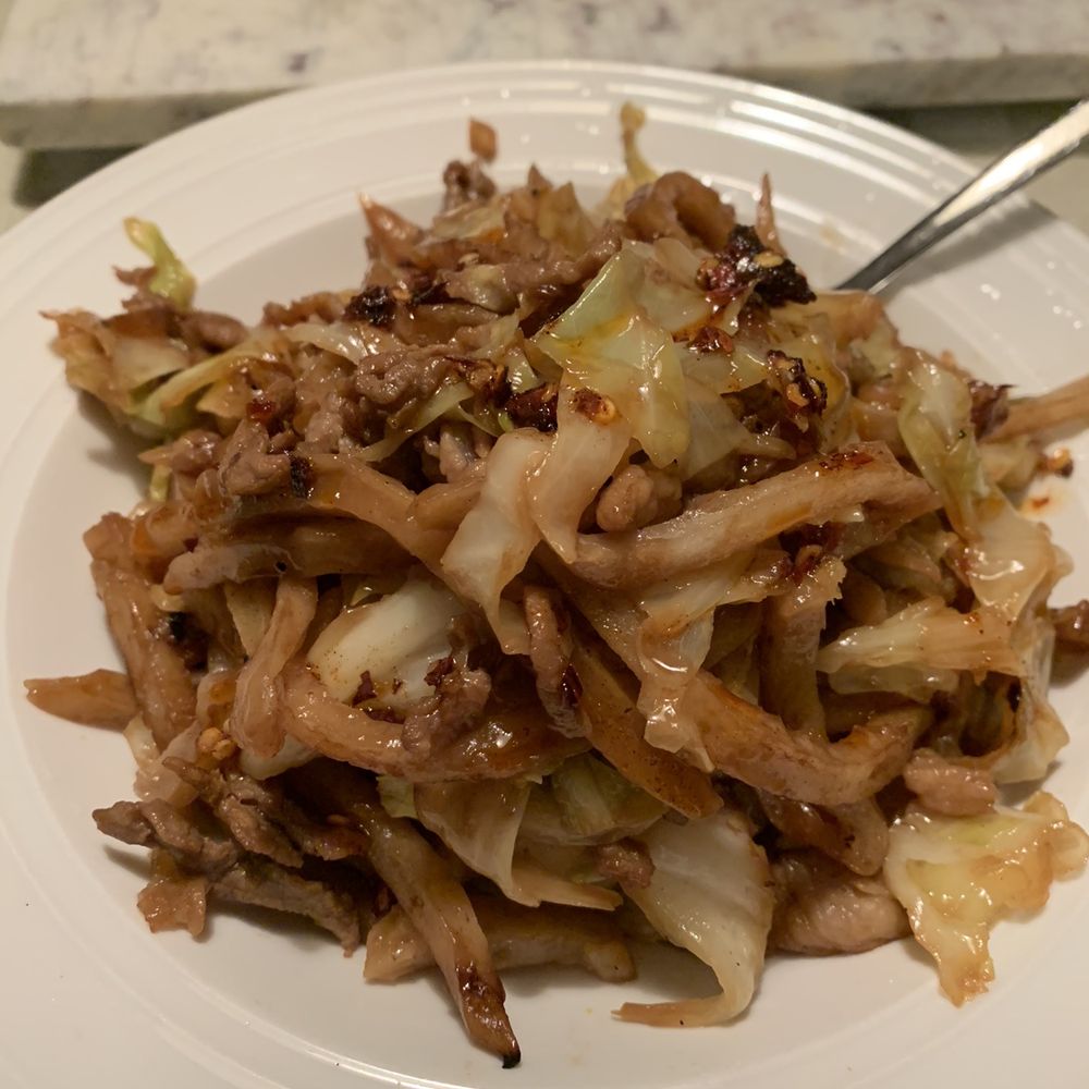 Stir fried chinese pancake with pork and their homemade chili oil