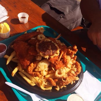 Neptune's Net - Neptune's Sampler 12.95 Fish, shrimp, scallop, clam strips, crab cake, calamari - Seafood Near Me - Malibu, California
