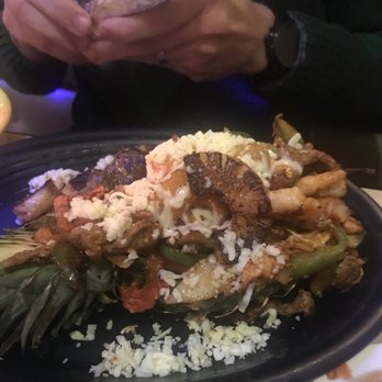 El Jinete - Fajita served inside a pineapple with shrimp, chicken, steak and chorizo - Mexican Near Me - Taylor Mill, Kentucky