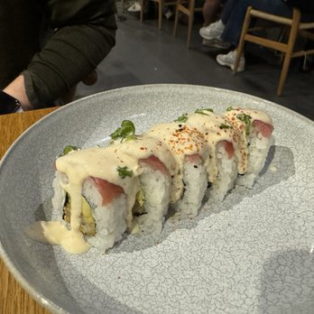 Nikkei 103 - Overcooked rice buried in a sour cream tangy sauce. The fried shrimp had no flavor under a razor thin slice of tuna on top. Pass. - Japanese Near Me - Barcelona, B