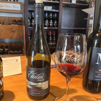 Lake Chelan Winery - a glass of wine and a bottle of wine - Wineries Near Me - Chelan, Washington
