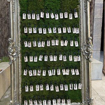Napa Note - The keys, reminiscent of the iconic "key to Wonderland," are beautifully arranged in a creative escort display, guiding guests to their seat - Calligraphy Near Me