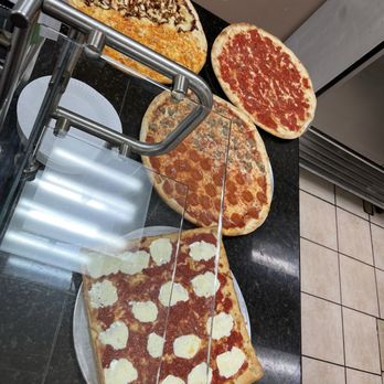 Jersey's Tomato Pie & Bistro - Each day they offer many types of slices. - Italian Near Me - Southampton, Pennsylvania