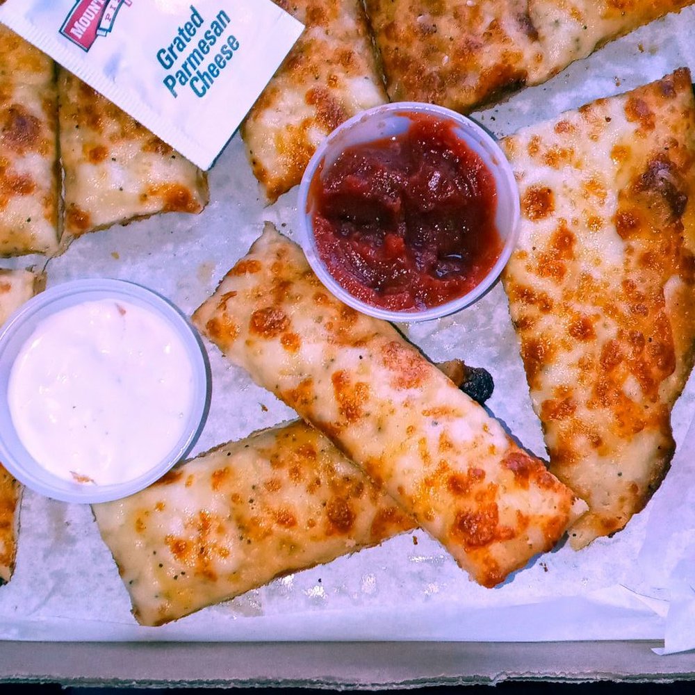 Mountain Mike's Pizza - Cheesy breadsticks with a choice of ranch marinara or blue cheese dressing to dip them in. Really good. Their garlic bread is also good. - Pizza Near Me - Roseville, California Mountain Mike's Pizza - Cheesy breadsticks with a choice of ranch marinara or blue cheese dressing to dip them in. Really good. Their garlic bread is also good. - Pizza Near Me - Roseville, California