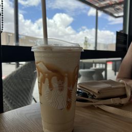 a cup of iced coffee on a table
