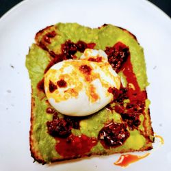 Magpie Coffeeshop - Spicy avocado toast, with an added poached egg.