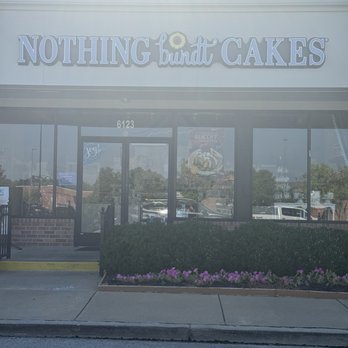 Nothing Bundt Cakes - Front sign at end of day sun behind it - Bakeries Near Me - Saint Peters, Missouri Nothing Bundt Cakes - Front sign at end of day sun behind it - Bakeries Near Me - Saint Peters, Missouri