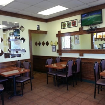 American Wings & Deli - a dining area with tables and chairs - Delis Near Me - Warner Robins, Georgia American Wings & Deli - a dining area with tables and chairs - Delis Near Me - Warner Robins, Georgia