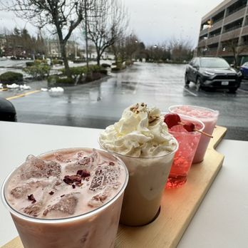 Two Sisters Coffee - three different beverages on a tray - Coffee & Tea Near Me - Olympia, Washington Two Sisters Coffee - three different beverages on a tray - Coffee & Tea Near Me - Olympia, Washington