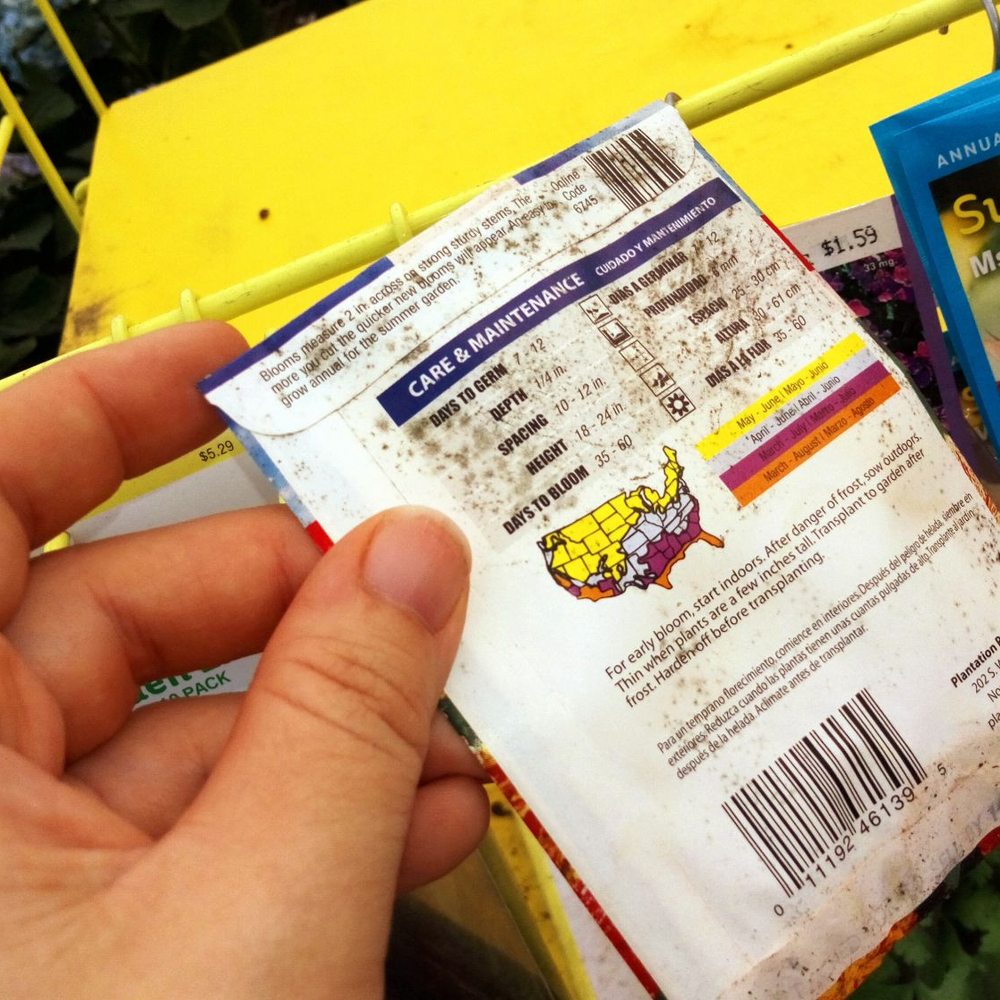 Lowe's Home Improvement - Back side of the visibly moldy seed pack at Lowes. They keep seeds near plants, and spray water on the seeds when watering plants. - Hardware Stores Near Me - Gainesville, Florida