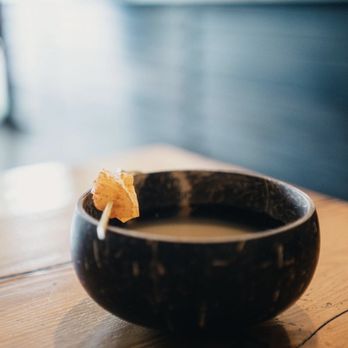 Nativ Cafe - a cup of coffee with a piece of bread sticking out of it - Coffee & Tea Near Me - White Salmon, Washington