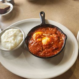 Shashuka.. An African dish consisting of poached eggs in a tomato sauce and spices