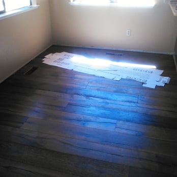 Powell Flooring - a room with wood floors and a window - Carpet Installation Near Me Powell Flooring - a room with wood floors and a window - Carpet Installation Near Me