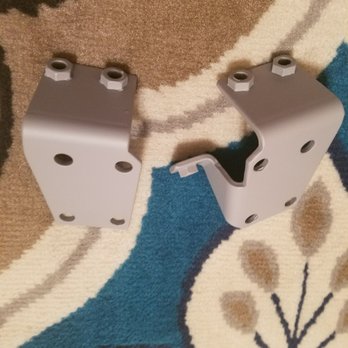 Blast Tech - two pieces of white hardware on a rug - General Contractors Near Me - Fresno, California