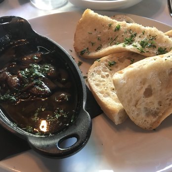 Table 31 - The Stinking Rose $7, roasted garlic and olive oil on ciabatta. There isn't enough bread to finish the dish though. - New American Near Me - Mooresville, North Carolina Table 31 - The Stinking Rose $7, roasted garlic and olive oil on ciabatta. There isn't enough bread to finish the dish though. - New American Near Me - Mooresville, North Carolina