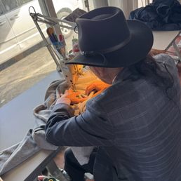 Khahn, the owner immediately getting to work on my sweatshirt. Khahn, the owner immediately getting to work on my sweatshirt.