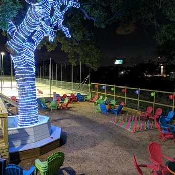 Sideout Volleybar - a tree decorated with neon lights - Sports Bars Near Me - Houston, Texas Sideout Volleybar - a tree decorated with neon lights - Sports Bars Near Me - Houston, Texas
