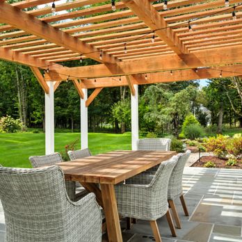 Redbud Development - Stepping-stones lead you to the raised bluestone patio with a custom pergola with posts wrapped in Azek - Masonry/Concrete Near Me - Wilton, New York