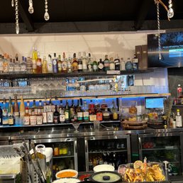 a counter with food and drinks a counter with food and drinks