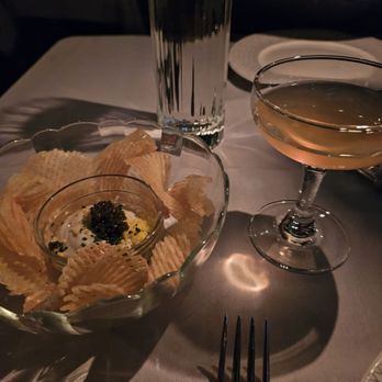 Maple & Ash - Complementary cocktail and chips with caviar - Steakhouses Near Me - Chicago, Illinois
