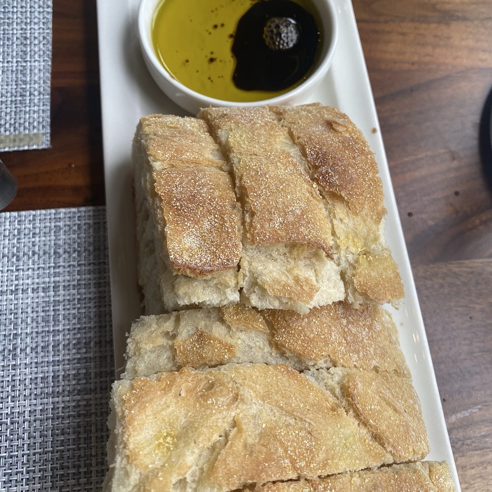 Novo Cucina - Ciabatta with olive oil and balsamic (complimentary, but don't forget to request it! $3+ for extra) - Pizza Near Me - Dunwoody, Georgia Novo Cucina - Ciabatta with olive oil and balsamic (complimentary, but don't forget to request it! $3+ for extra) - Pizza Near Me - Dunwoody, Georgia