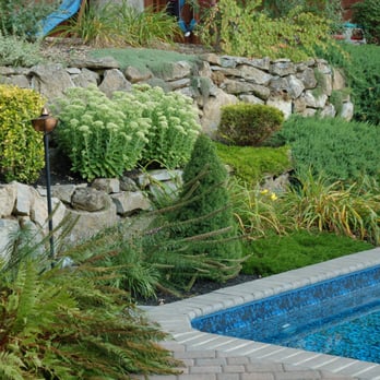Splendor Landscaping Designs - a garden with a pool - Landscaping Near Me - Commack, New York