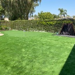 Portion of the lawn with putting green in the corner.