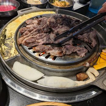 Cow Wow Korean BBQ - Thinly Sliced Brisket on the grill. - Korean Near Me - Suwanee, Georgia Cow Wow Korean BBQ - Thinly Sliced Brisket on the grill. - Korean Near Me - Suwanee, Georgia