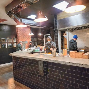 L’Hamburger - workers preparing food in a restaurant - Burgers Near Me - Montreal, Quebec L’Hamburger - workers preparing food in a restaurant - Burgers Near Me - Montreal, Quebec