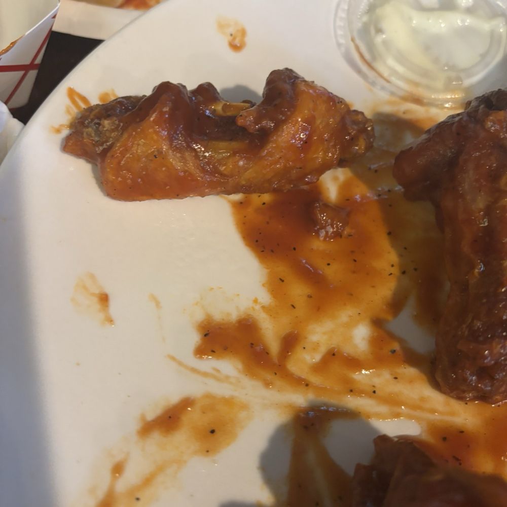 Sonny Red's - Terrible wing, looks like the chef took a bite out of it - Pizza Near Me - Lackawanna, New York