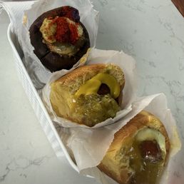 The Classic Hot Dog, Signature Poi Dog, Hula Polish Dog The Classic Hot Dog, Signature Poi Dog, Hula Polish Dog