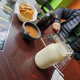 Horchata, Jamaica in the Mason jars. They are big jars. Salsa and chips. 10/10 Horchata, Jamaica in the Mason jars. They are big jars. Salsa and chips. 10/10