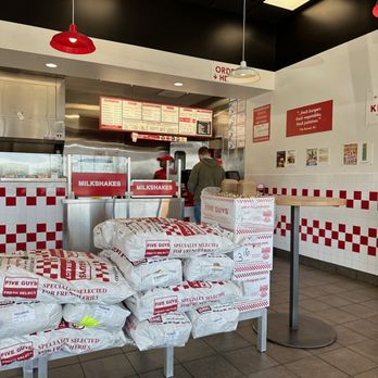Five Guys - Sacks of potatoes - they note where they came from, and of course, peanuts. - Burgers Near Me - Wheaton, Illinois