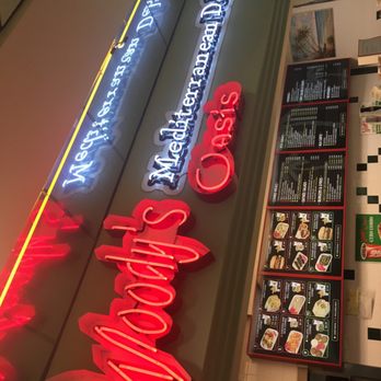 Woody's Oasis - a neon sign for a restaurant - Sandwiches Near Me - East Lansing, Michigan Woody's Oasis - a neon sign for a restaurant - Sandwiches Near Me - East Lansing, Michigan
