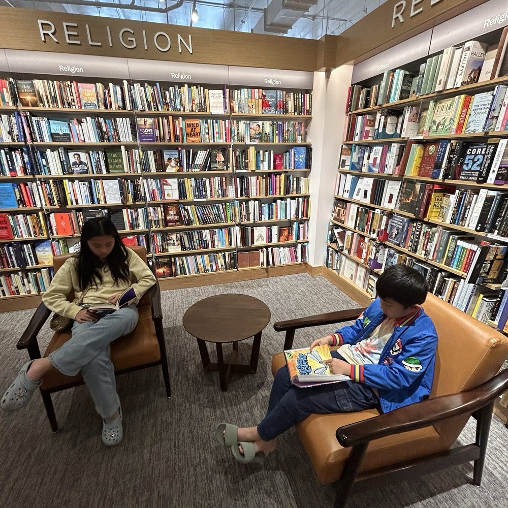 Large selection of books and comfy chairs to read in