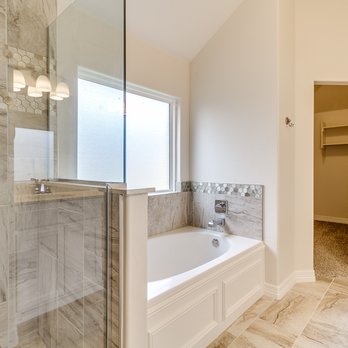 Authentic Custom Homes - a bathroom with a walk in shower - General Contractors Near Me - Edmond, Oklahoma Authentic Custom Homes - a bathroom with a walk in shower - General Contractors Near Me - Edmond, Oklahoma