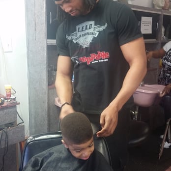 Jermaine's Golden Clippers - Jermaine at work in my son's hair, getting him ready for his trip! - Barbers Near Me - Bellwood, Illinois Jermaine's Golden Clippers - Jermaine at work in my son's hair, getting him ready for his trip! - Barbers Near Me - Bellwood, Illinois