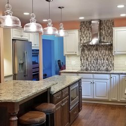 McLusky Showcase Kitchens & Baths - Check out this beautiful two tone kitchen renovation by McLusky Showcase Kitchens & Baths! Kitchen features large island.