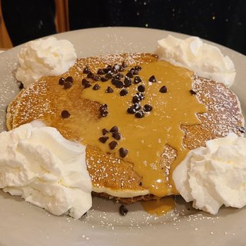 Main Street Café - a plate of pancakes with whipped cream and chocolate chips - Coffee & Tea Near Me - Stockbridge, Massachusetts