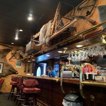 Louie's Steak & Seafood - Bar area covers one entire end. Love this decor. - Seafood Near Me - Kenai, Alaska Louie's Steak & Seafood - Bar area covers one entire end. Love this decor. - Seafood Near Me - Kenai, Alaska
