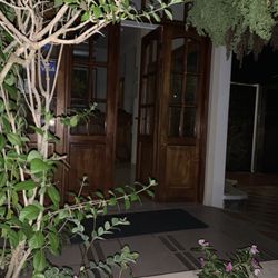 Hotel Villa Laguna - Me out side in rain.  Samual inside in the light and air conditioning
