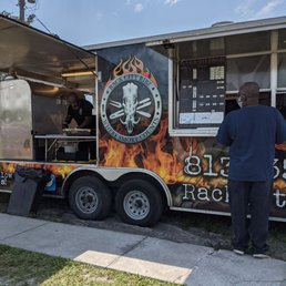 a man standing in front of a food truck