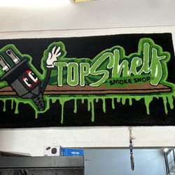 Top Shelf Smoke Shop - I just think this is cool. It's a custom welcome mat carpet thing.