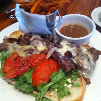 Boure Restaurant - Ribeye sandwich with sweet potato fries. Really yummy! - New American Near Me - Oxford, Mississippi Boure Restaurant - Ribeye sandwich with sweet potato fries. Really yummy! - New American Near Me - Oxford, Mississippi