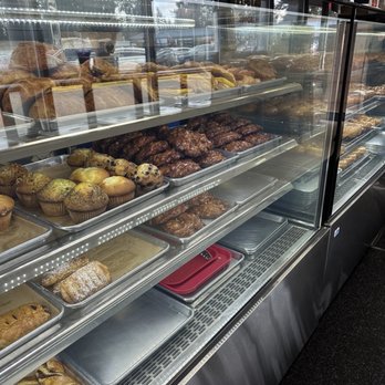 Factory Donuts - a display case filled with baked goods - Donuts Near Me - Kirkland, Washington Factory Donuts - a display case filled with baked goods - Donuts Near Me - Kirkland, Washington