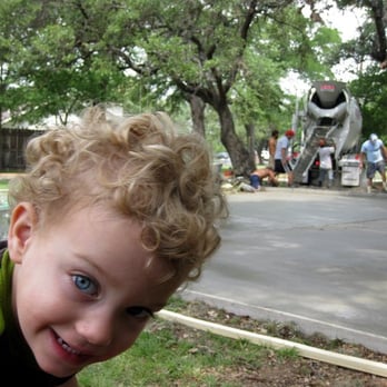 Austin Concrete Construction - 2 yr old boy, excited about concrete pour - Landscaping Near Me