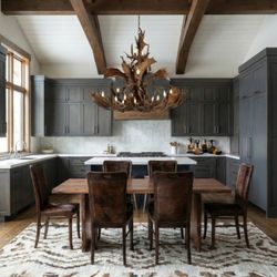 Adobe Interiors - Theodore cowhide dining chairs around a live-edge dining table.